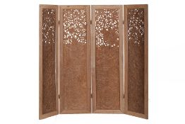 AN INDONESIAN CARVED WOOD FOUR FOLD SCREEN