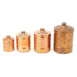 A SET OF FOUR GRADUATED COPPER CANISTERS