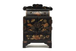 A JAPANESE BLACK LACQUERED TABLE CABINET