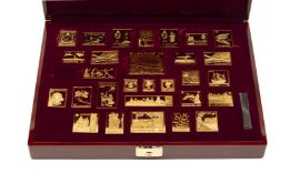 A COLLECTION OF GOLD-PLATED SILVER SINGAPORE STAMPS (1995)