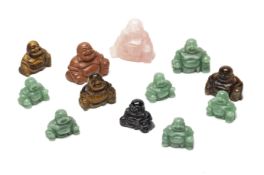 A GROUP OF CARVED HARDSTONE MODELS OF BUDDHA