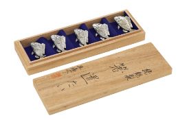 A SET OF FIVE JAPANESE WHITE METAL CHOPSTICK RESTS