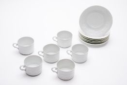 A SET OF SIX PORCELAIN LIMOGES COFFEE CUPS AND SAUCERS