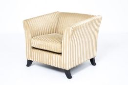 A STRIPED UPHOLSTERED ARMCHAIR