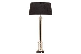 A TALL SILVERED METAL TABLE LAMP