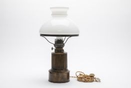 A TABLE LAMP WITH OPAQUE GLASS SHADE