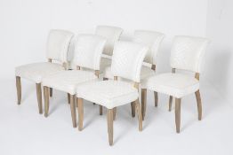 A SET OF SIX LEATHER DINING CHAIRS