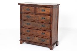 A TEAK CHEST OF DRAWERS