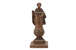 AN ANTIQUE CARVED WOOD SANTOS FIGURE OF SAINT VINCENT