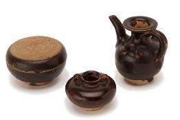 A GROUP OF SMALL BROWN GLAZED POTTERY VESSELS