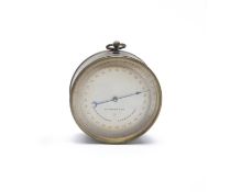 A FRENCH BRASS CASED ANEROID BAROMETER