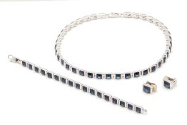 A RHODIUM PLATED AND PASTE JEWELLERY SET BY AIGNER