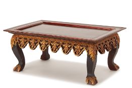 AN INDONESIAN CARVED AND LACQUERED SMALL TABLE/STAND