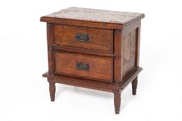 A TEAK BEDSIDE CHEST OF DRAWERS