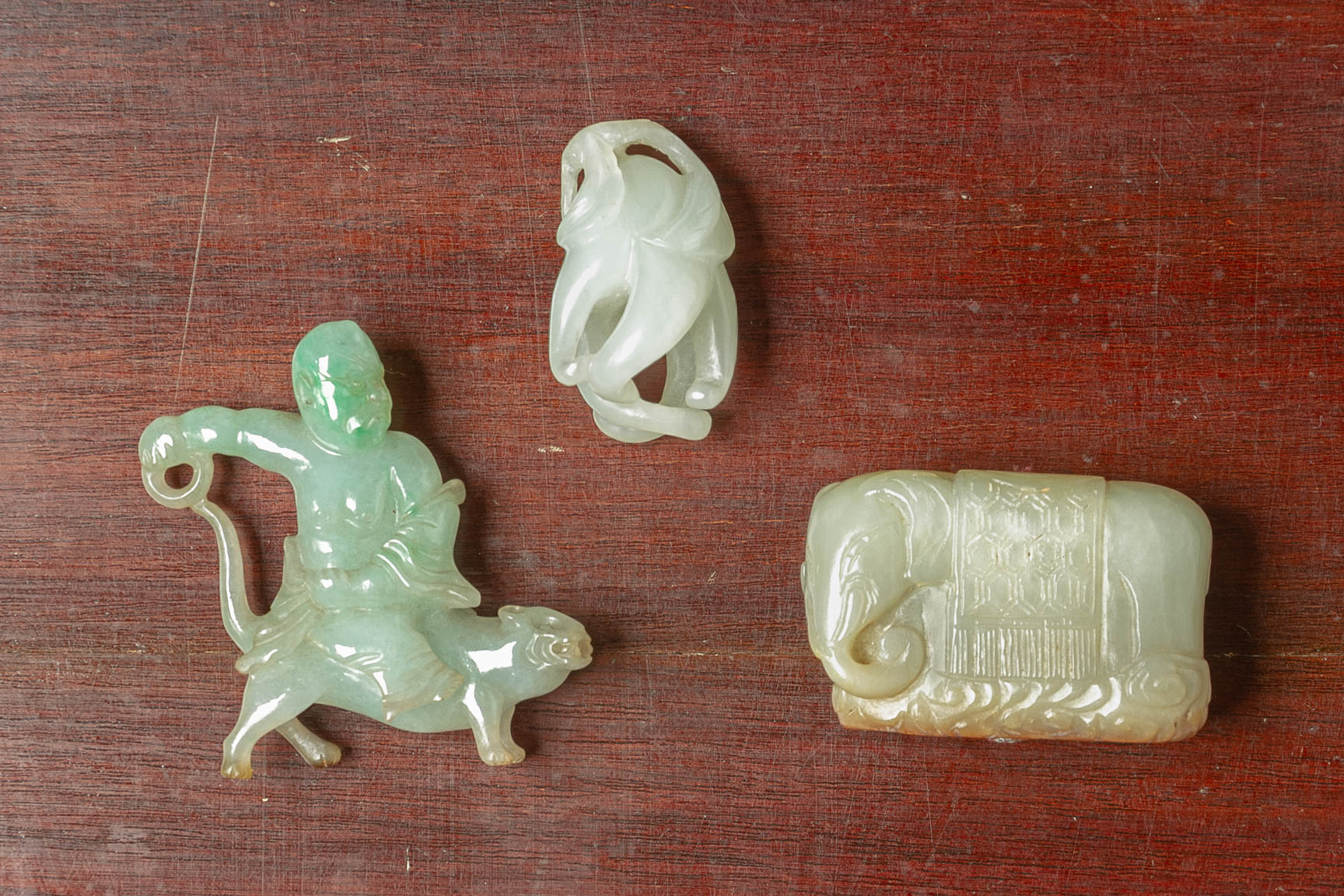 A GROUP OF THREE JADE CARVINGS