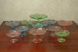 A GROUP OF MOULDED AND COLOURED GLASS DESSERT STANDS