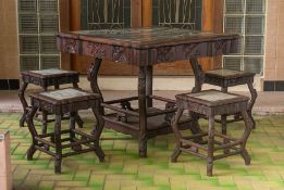 A MARBLE INSET AND BLACKWOOD MAHJONG TABLE AND STOOLS