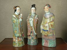 A GROUP OF THREE FAMILLE ROSE PORCELAIN FIGURES