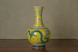 A FAMILLE ROSE YELLOW GROUND DRAGON VASE
