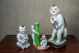 A GROUP OF PORCELAIN FIGURES OF BOYS