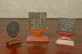 THREE SMALL ARCHIC STYLE BRONZE PLAQUES