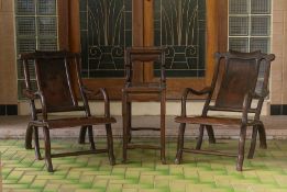 A PAIR OF BLACKWOOD RECLINING ARMCHAIRS AND TABLE