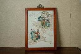 A FRAMED PORCELAIN PLAQUE