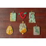 A GROUP OF FIVE CARVED JADE PENDANTS