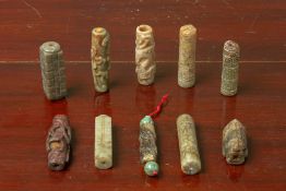 A GROUP OF TEN ARCHAIC STYLE CARVED JADE CYLINDRICAL TUBES