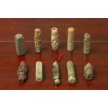 A GROUP OF TEN ARCHAIC STYLE CARVED JADE CYLINDRICAL TUBES