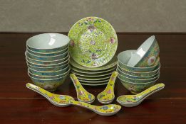 A GROUP OF CHINESE YELLOW GROUND FAMILLE ROSE DINNERWARES