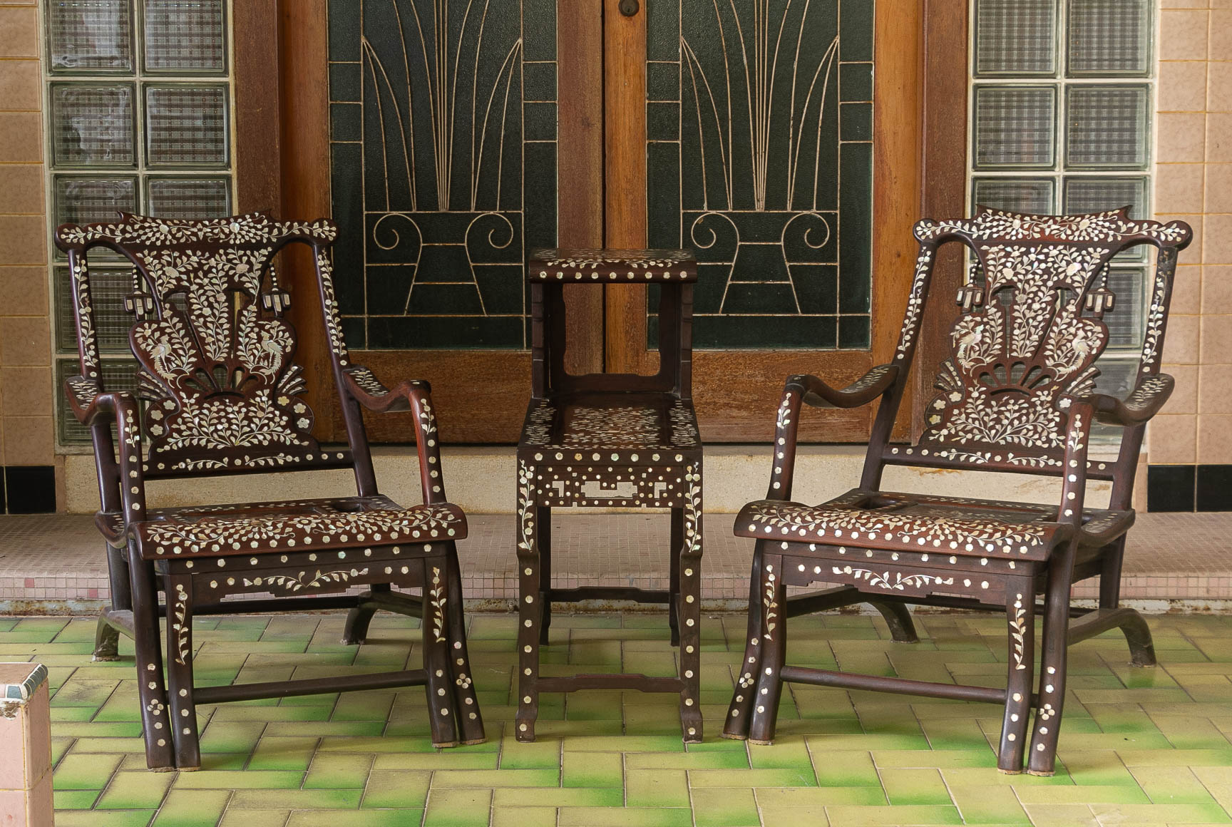 A PAIR OF MOTHER OF PEARL INLAID CHAIRS AND A SIDE TABLE