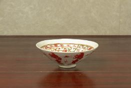 A MOULDED AND POLYCHROME DECORATED BOWL