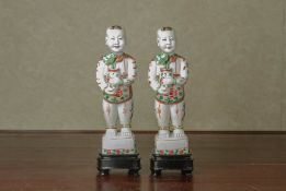 A PAIR OF FAMILLE VERTE MODELS OF BOYS