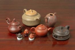 A GROUP OF YIXING POTTERY TEAPOTS