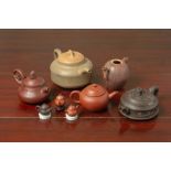 A GROUP OF YIXING POTTERY TEAPOTS