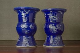 A PAIR OF BLUE GROUND SLIP DECORATED VASES