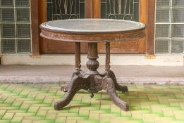 A MARBLE TOPPED CARVED WOOD KOPITIAM TABLE