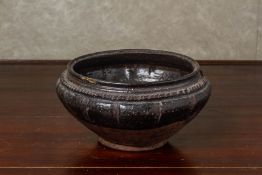 A SOUTH EAST ASIAN BROWN GLAZED POTTERY BOWL