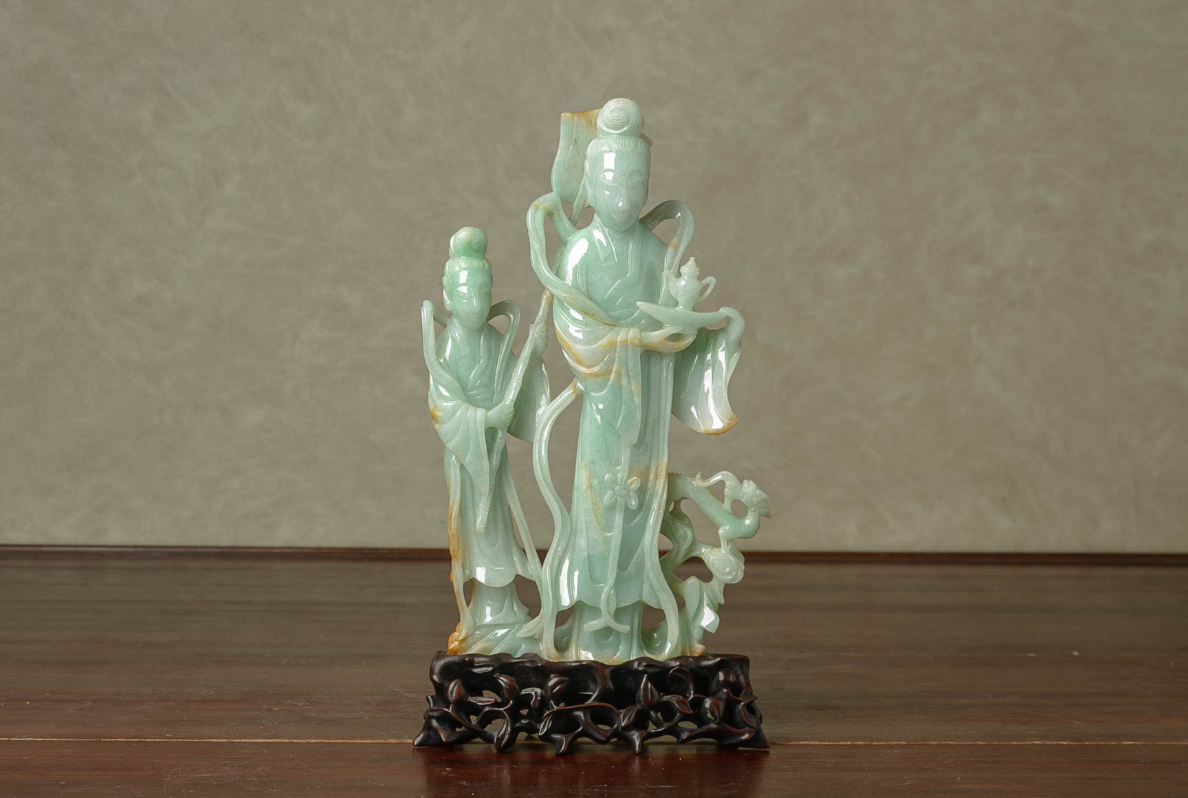 A CARVED JADE MODEL OF FIGURES