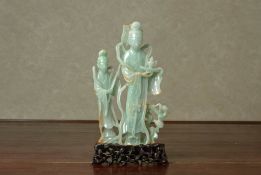 A CARVED JADE MODEL OF FIGURES