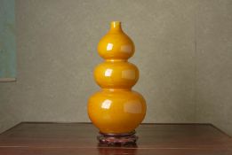 A YELLOW GLAZED TRIPLE GOURD PORCELAIN VASE