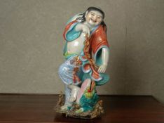 A FAMILLE ROSE PORCELAIN MODEL OF LIU HAI