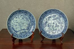 TWO SIMILAR BLUE AND WHITE PORCELAIN CHARGERS