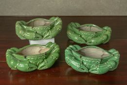 FOUR GREEN GLAZED CERAMIC MODELS OF CRABS