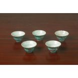 A MATCHED SET OF FIVE PERANAKAN TURQUOISE GROUND TEA BOWLS