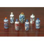 A GROUP OF UNDERGLAZE BLUE AND RED SNUFF BOTTLES