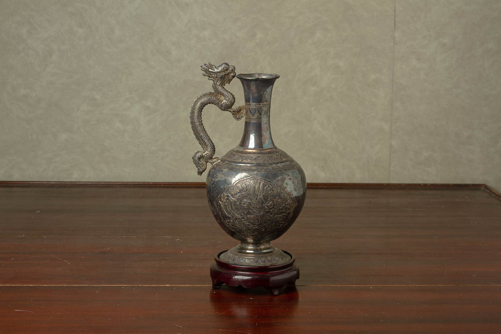 A CHINESE WHITE METAL EWER