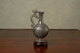 A CHINESE WHITE METAL EWER