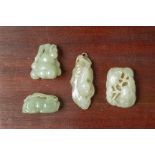 A GROUP OF FOUR JADE CARVINGS